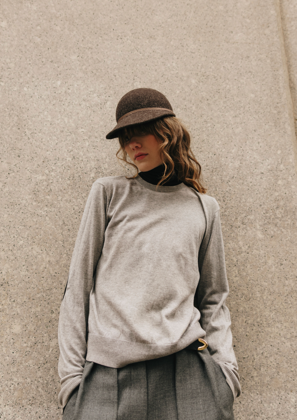 Dark gray felted hat with a brown band
