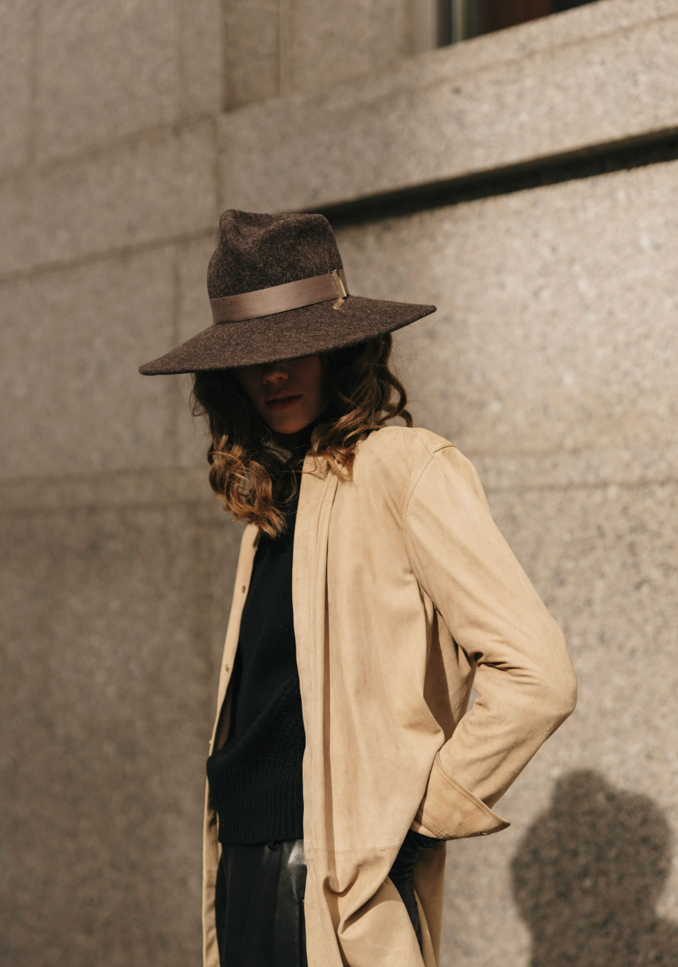 Person wearing a wide-brimmed hat