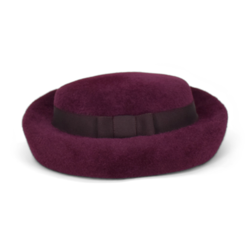 Purple hat with a black band on a white background