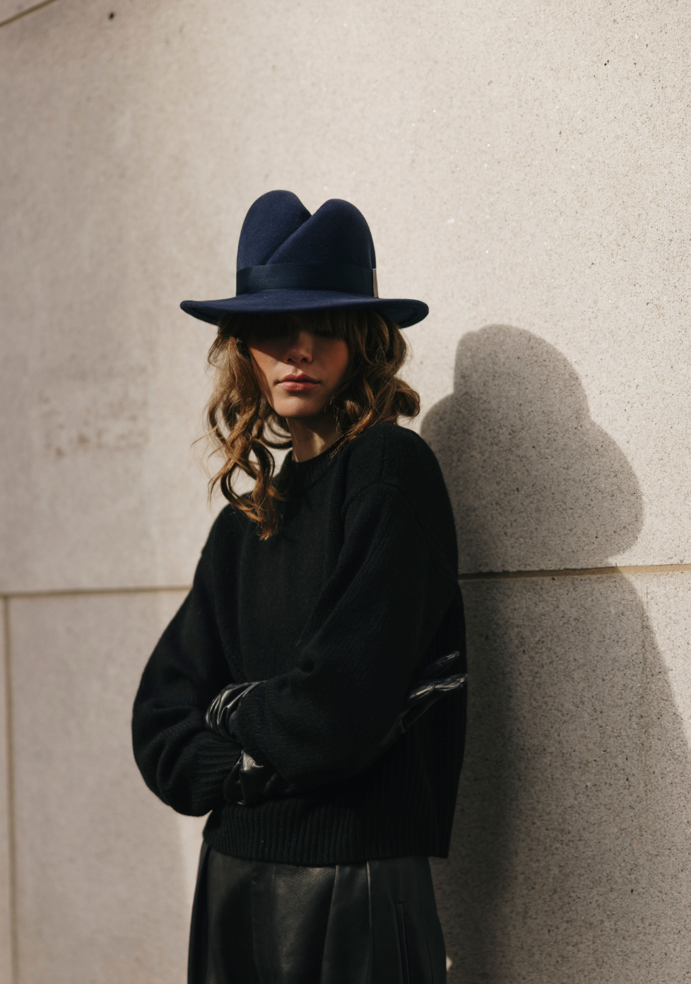 Person wearing a dark blue hat