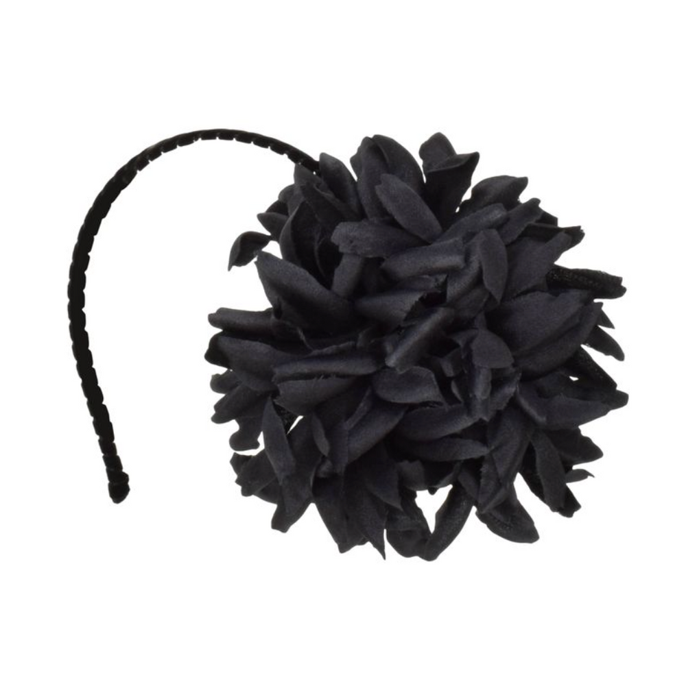 Black cat toy with a headband on a white background