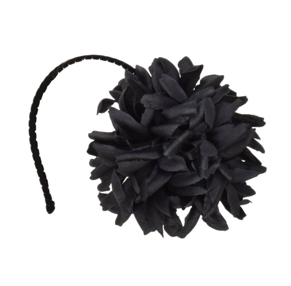 Black cat toy with a headband on a white background