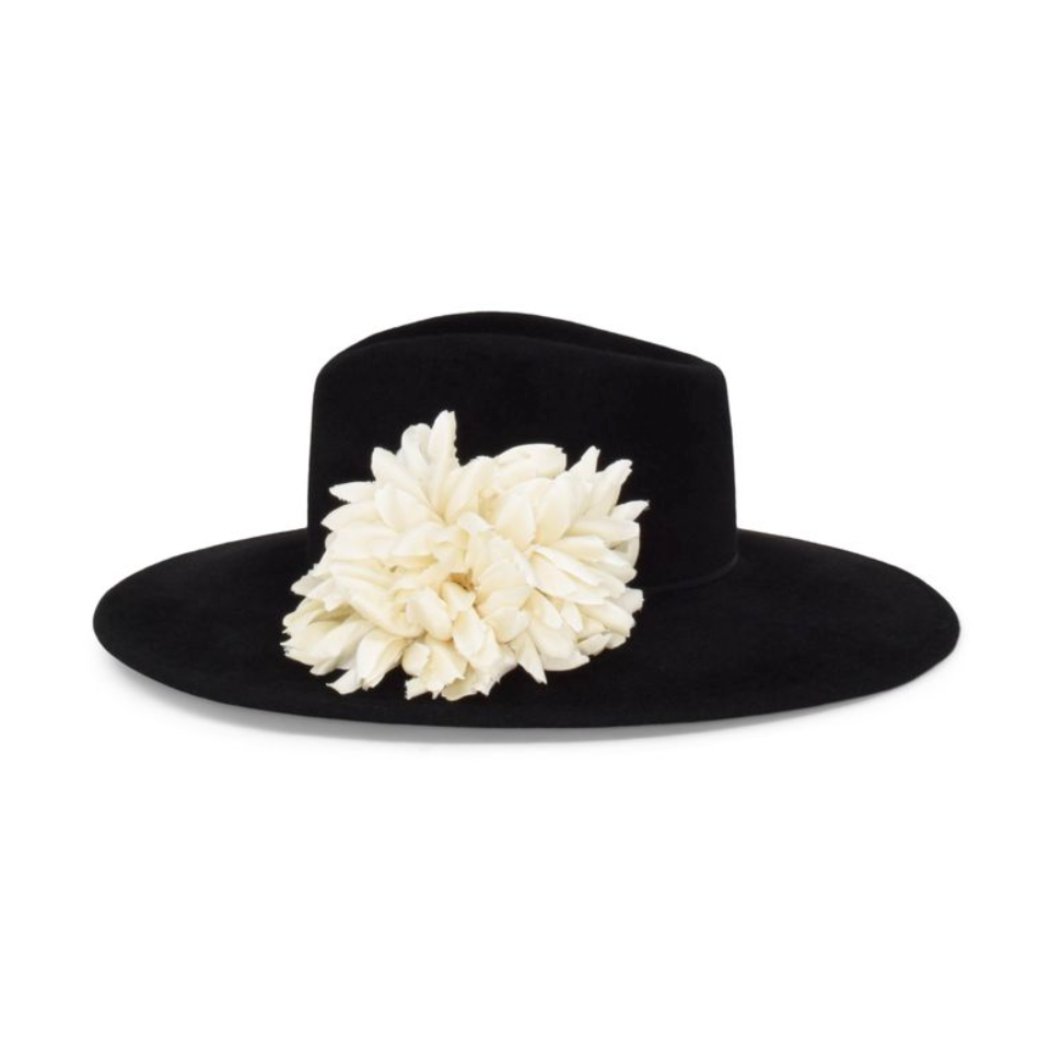 Black hat with a large white flower on a white background