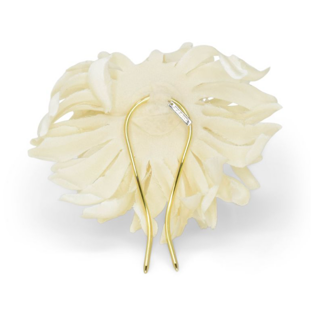 Gold earring with a small diamond on a white background