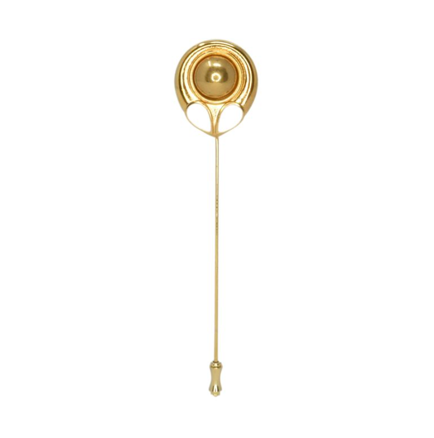 Gold tie clip on a white background