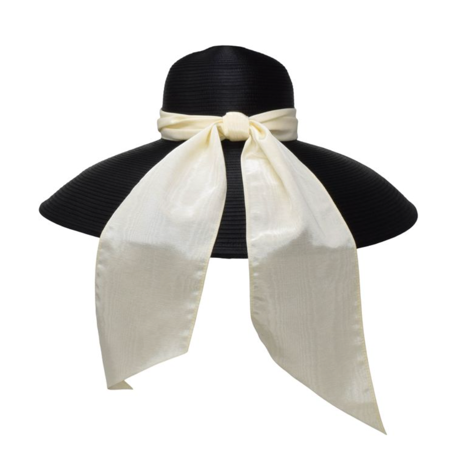 Black sun hat with a white scarf tied around it on a white background