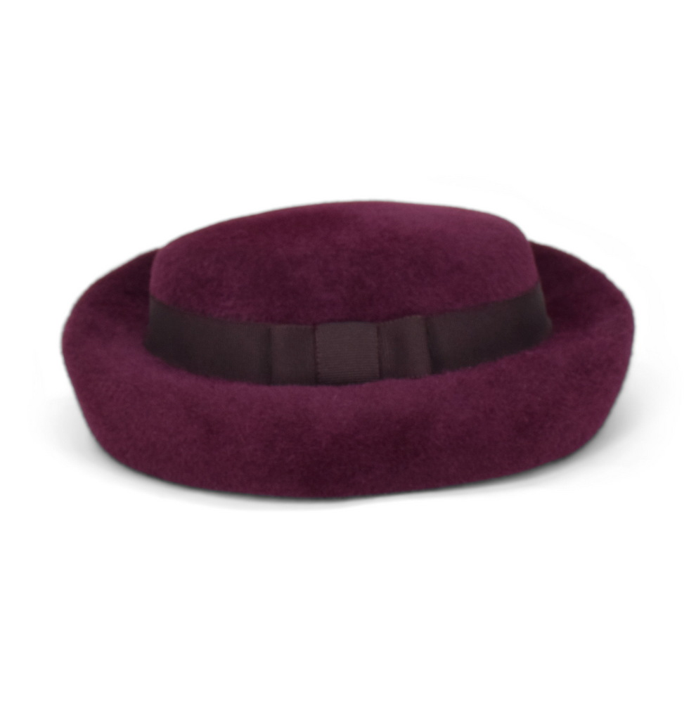 Purple hat with a black band on a white background
