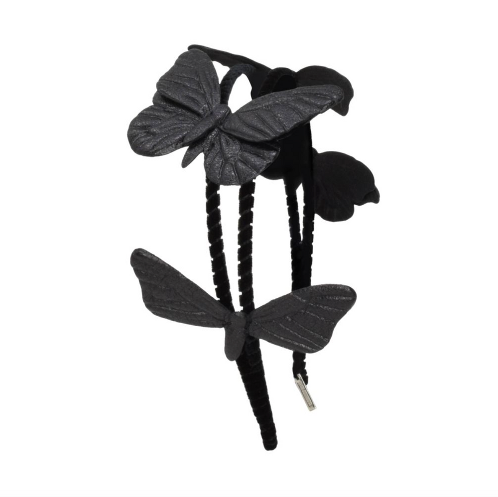 Black butterfly hair clip on a white background