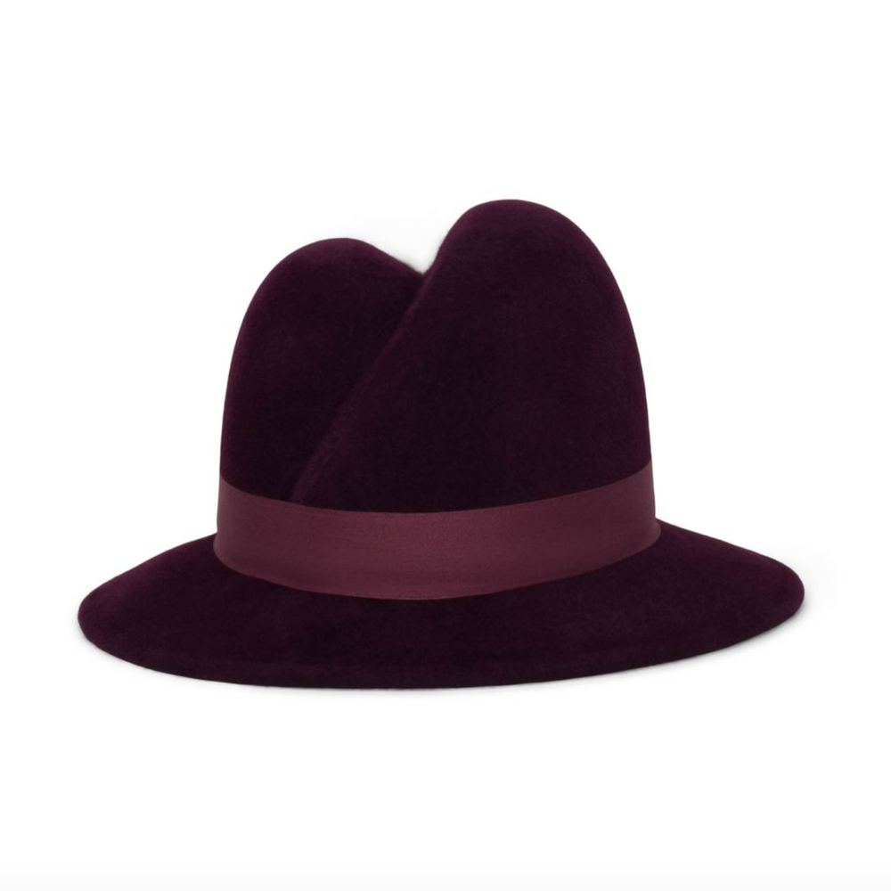 Purple fedora hat with a wide brim and band on a white background
