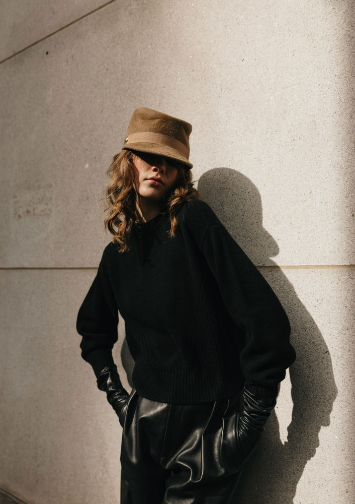 Person wearing Brown felt hat with a band