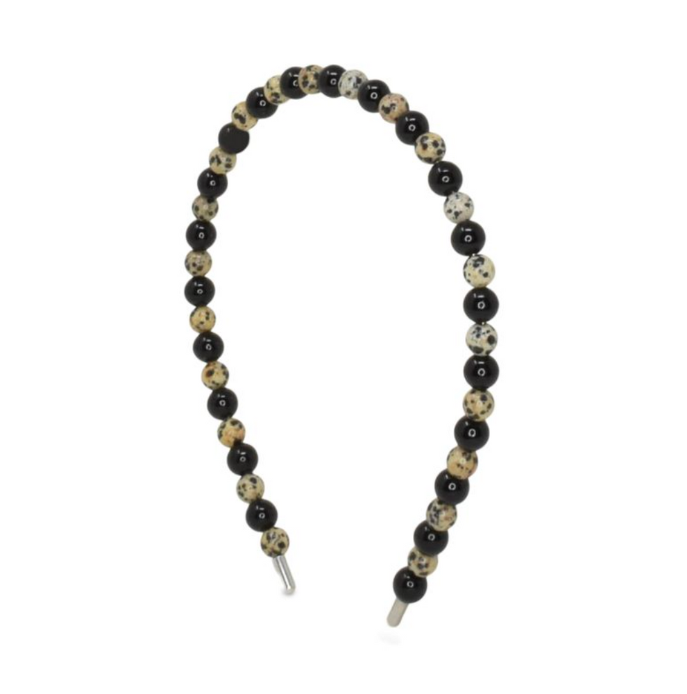 Beaded headband with black, white, and beige beads on a white background