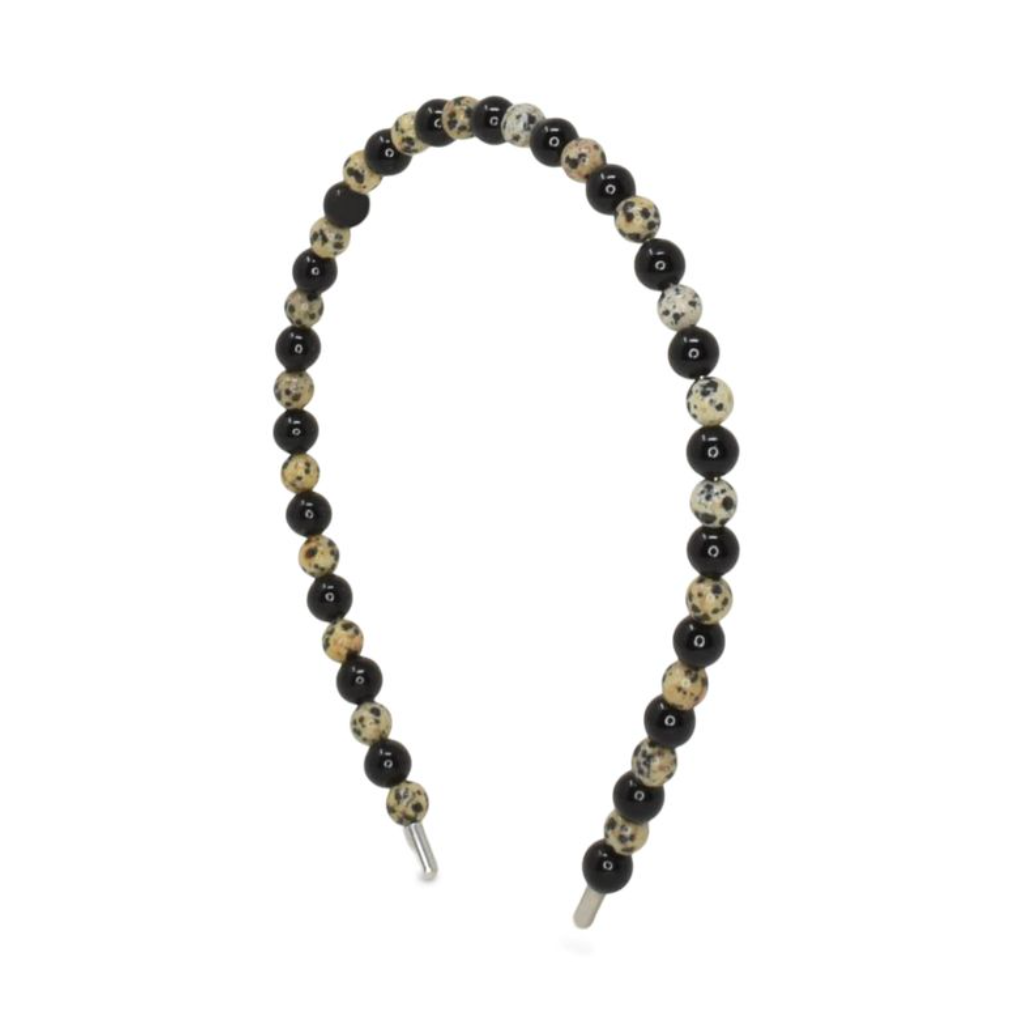 Beaded headband with black, white, and beige beads on a white background
