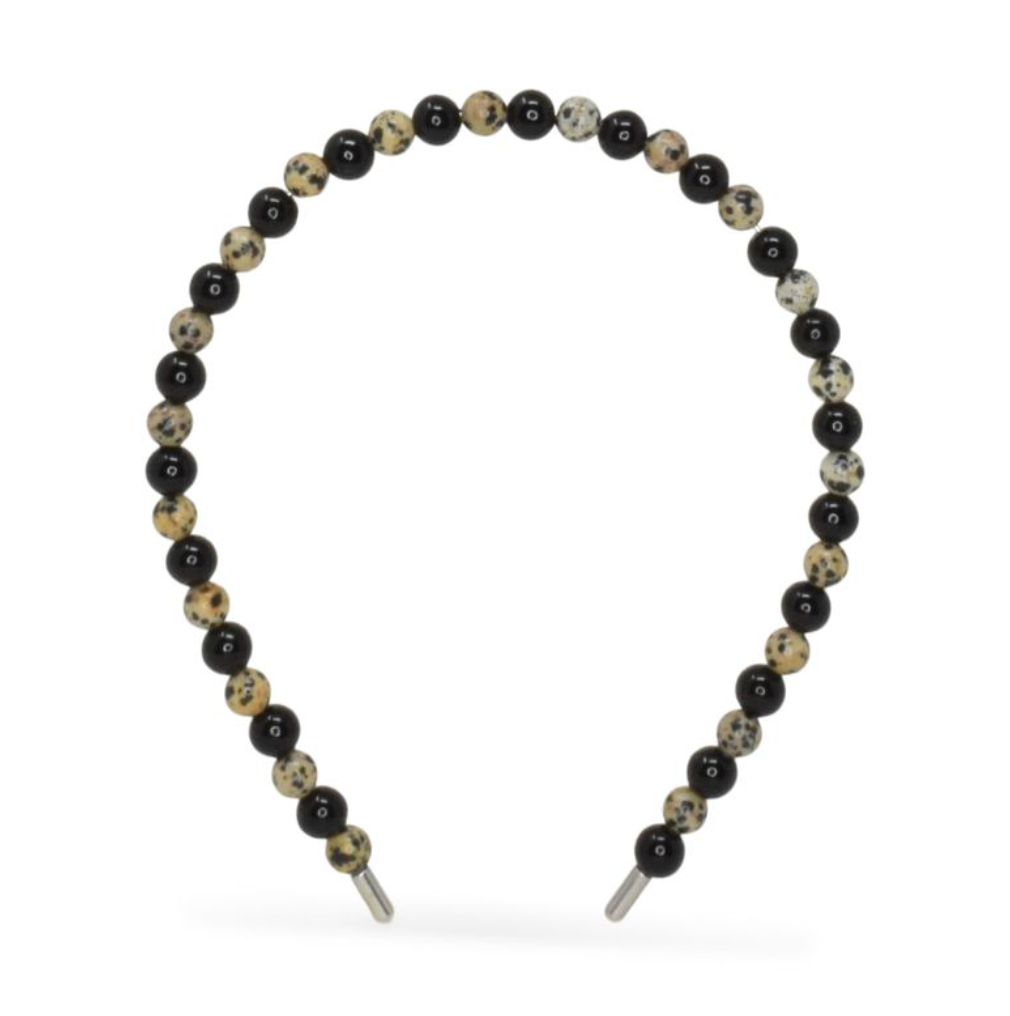 Beaded with black and beige beads on a white background