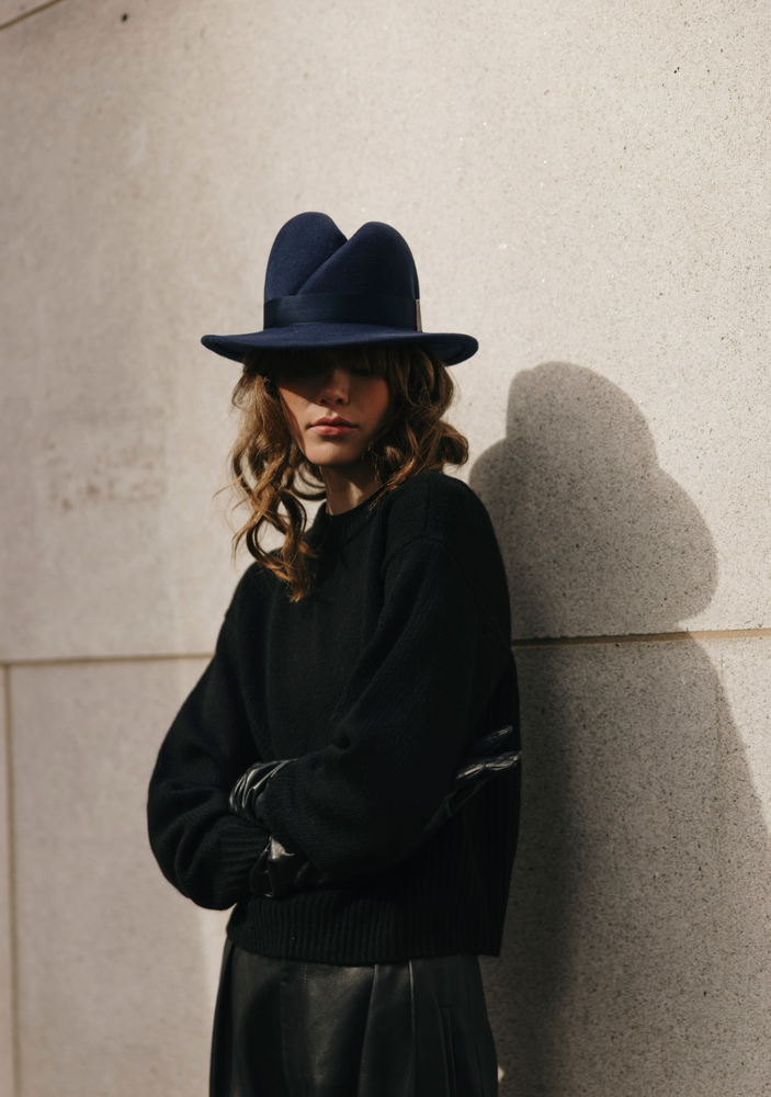 Person wearing a dark blue hat 
