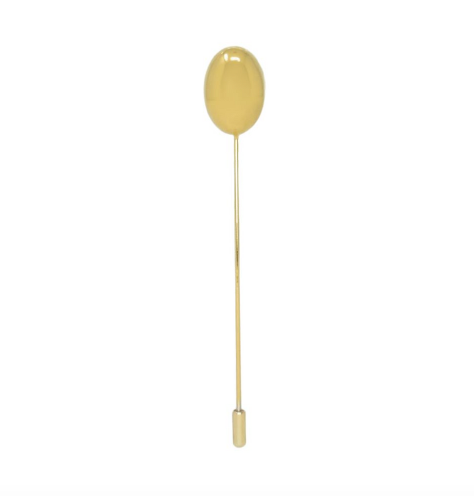 Gold spoon with a long handle on a white background